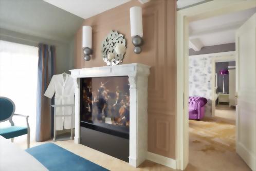 The bedrooms feature a 55" flat screen presented in a marble fireplace mantle.
