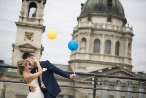 A newly married couple photographed with a beautiful background of St. Stephen's Basilica.
